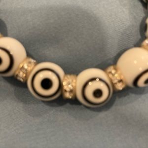 Black and white glass and crystal evil eye good luck stretch bracelet.